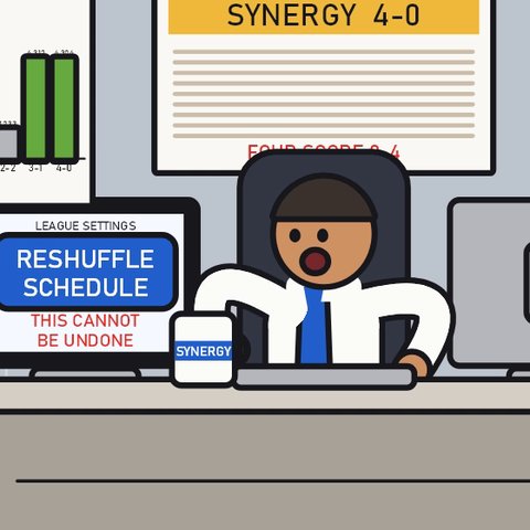 The Boss at his desk with a Synergy mug, the standings board on the wall behind him